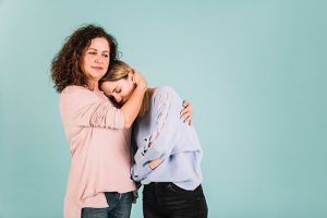children - mother comforts daughter