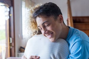 Children - Teen hugging mother